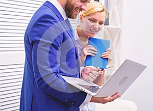 Two business people working together casual. Cheerful work of two people working in bright office. Business team