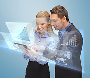 Two business people working with virtual screen