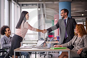 Two business teams successfully negotiating, shaking hands. photo