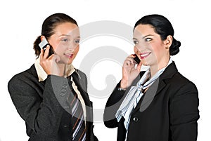 Two business woman on phone mobile