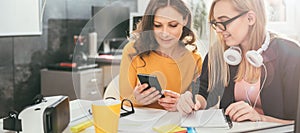 Two business woman working together at the office photo