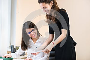 Two business women working at office