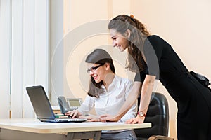 Two business women working at office