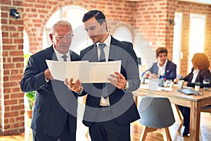 Two business workers working together