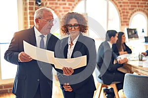 Two business workers working together