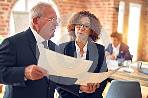 Two business workers working together