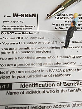 Two businessman discussion about usa tax form, w-8ben, certificate of foreign status of beneficial owner for united states tax wit