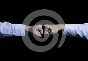 Two businessman hand fist boxing and fighting. Business competition concept.