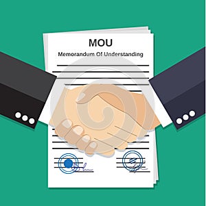 Two Businessman handshake on mou memorandum photo