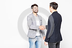 Two businessman handshake standing isolated on a white background