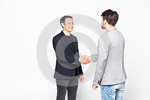 Two businessman handshake standing isolated on a white background