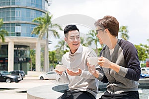 Two businessman having a casual meeting or discussion in the cit