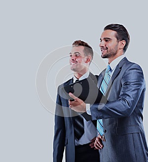 Two businessman looking at white background.