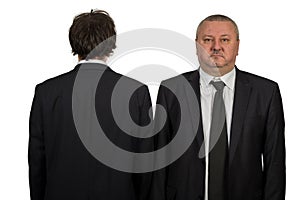 Two businessman looking at white background