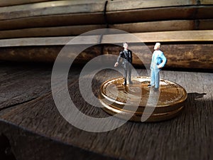 Two businessman mini figure toys, chit chat about bitcoin