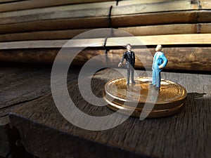 Two businessman mini figure toys, chit chat about bitcoin photo