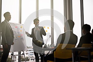 Two businessman presentation in a conference meeting room and Audience of the lecturer.