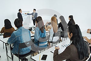 Two businessman presentation in a conference meeting room and Audience of the lecturer.