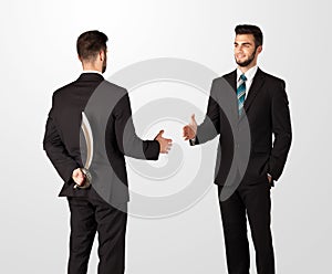 Two businessman shake hands