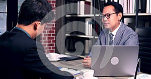 Two businessman signing contract document start business agreement dealing teamwork. Close up hand young man colleagues  meeting m