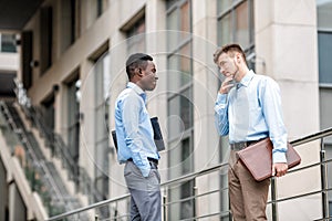 Two businessmen discussing project