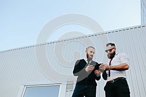 Two businessmen discussing something