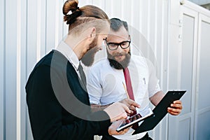 Two businessmen discussing something