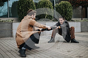 Two businessmen engaging in a playful tug-of-war outdoors