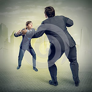Two businessmen fighting as sumoist