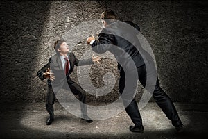 Two businessmen fighting as sumoist