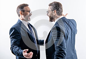 two businessmen fighting at rivalry isolated on white. businessmen having conflict fight in business. fighting between