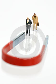 Two businessmen figurines with magnet