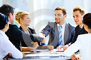 Two businessmen handshaking