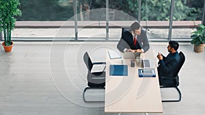 Two businessmen having business discussion in meeting at office