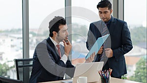 Two businessmen having business discussion in meeting at office