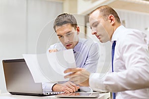 Two businessmen having discussion in office