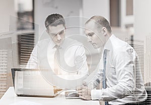 Two businessmen having discussion in office