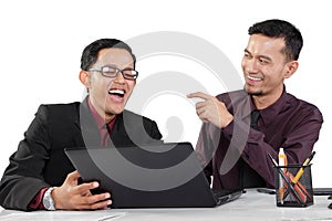 Two businessmen laughing
