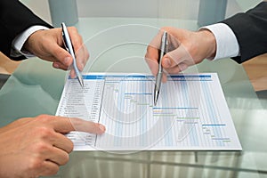 Two businessmen making gantt diagram