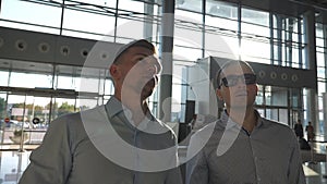 Two businessmen in meeting at office looking and discussion about something ahead. Young business men watching at