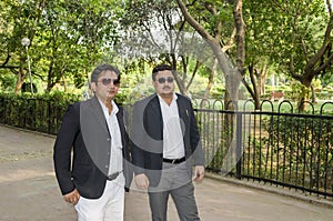 Two businessmen in park