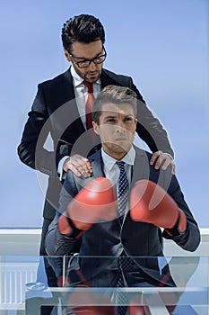 Two businessmen are preparing for battle