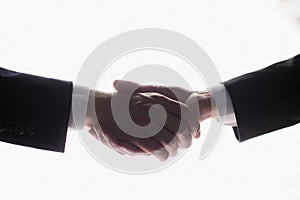 Two businessmen shake hands for agreement. Isolated image with white background, Business concept