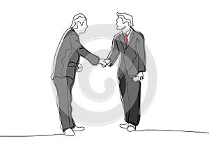 Two businessmen shake hands with each other