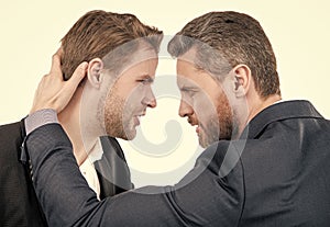 two businessmen starring to each other in business conflict, bad work