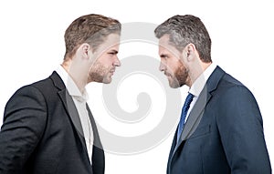 two businessmen starring to each other in business conflict, opposition