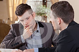 Two businessmen talking about an offer