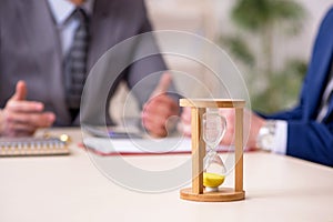 Two businessmen in time management concept