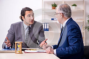 Two businessmen in time management concept