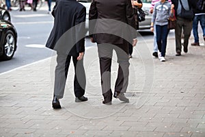 Two businessmen walking in the city